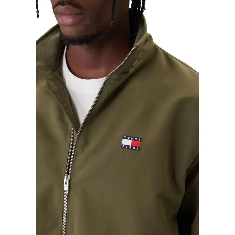 Olive green tommy hilfiger jeans bomber jacket with silver zipper and embroidered logo patch for men