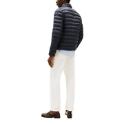Navy blue quilted nylon zip jacket for men by Tommy Hilfiger Jeans model DM0DM20658 shown from the front