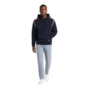 Navy blue Tommy Hilfiger Jeans men hoodie with red and white striped shoulder panels made from organic cotton