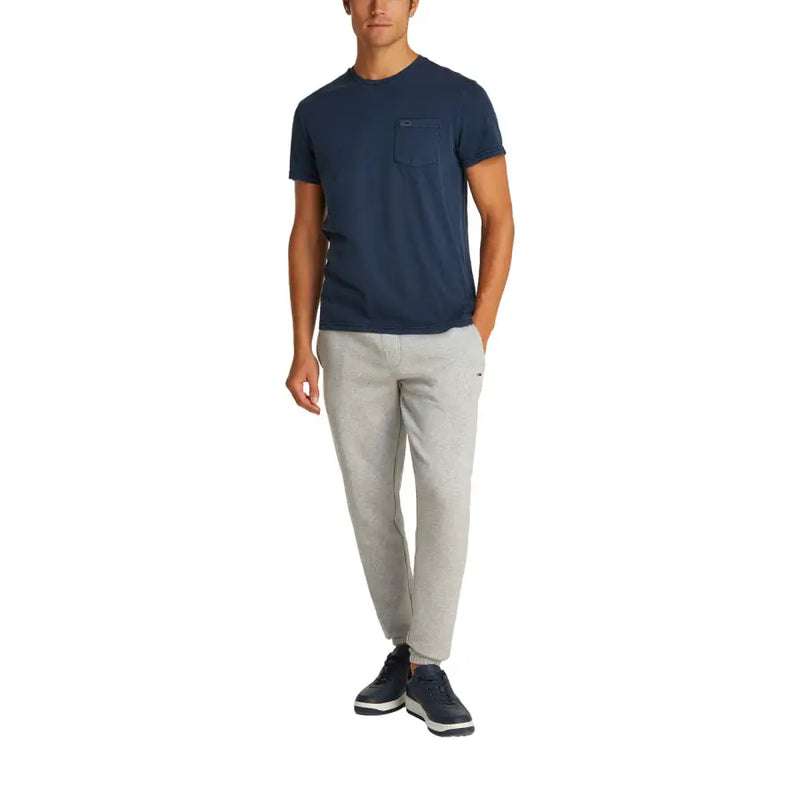 Navy blue tommy hilfiger jeans men round neck cotton t shirt with short sleeves chest pocket and subtle logo detail