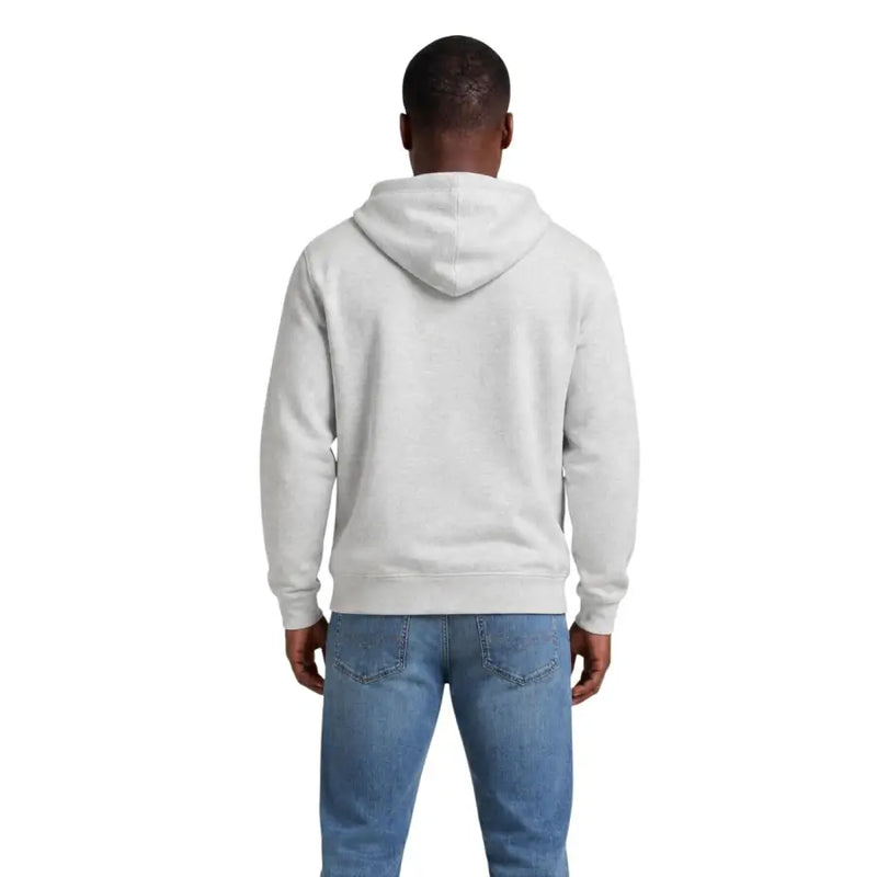 Tommy Hilfiger Jeans Grauer Herren-Hoodie aus Bio-Baumwolle mit klassischer Passform und gerippten Bündchen in einem sanften Hellgrau