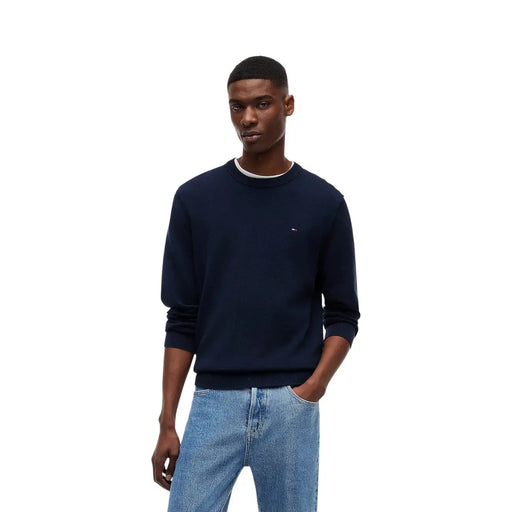 Navy blue Tommy Hilfiger crewneck sweater with white ribbed trim and small logo on left chest made from organic cotton
