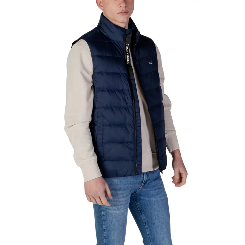 Navy blue quilted puffer vest with black zipper and Tommy Hilfiger Jeans branding on collar men sleeveless jacket