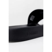 Black rubber Tommy Hilfiger Jeans men slide sandal with minimalist design and embossed brand logo size 2