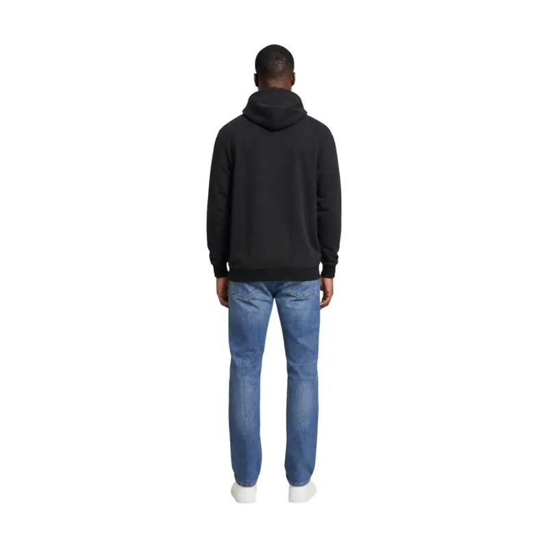 Black hooded sweatshirt by tommy hilfiger jeans featuring a classic minimalist design for men