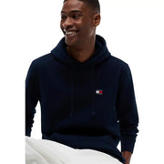 Navy blue tommy hilfiger jeans men sweatshirt hoodie with small embroidered logo on chest for casual wear