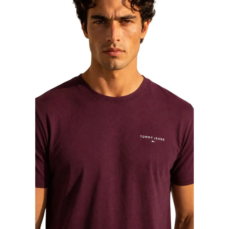 Maroon Tommy Hilfiger Jeans men t-shirt with subtle white logo on left chest made from comfortable fabric
