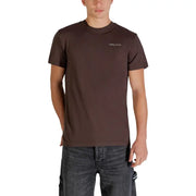 Tommy Hilfiger Jeans Männer t-shirt aus braunem Baumwollstoff mit einem kleinen weißen Logo auf der linken Brust