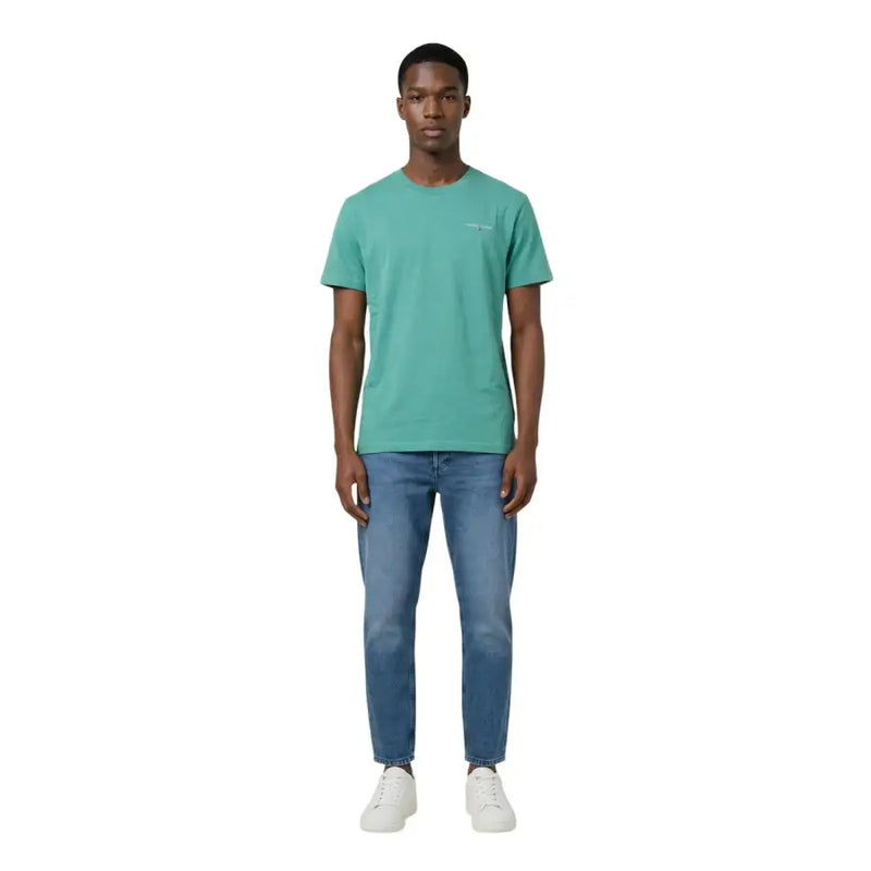 Tommy Hilfiger Jeans men t-shirt in teal cotton with short sleeves and a subtle embroidered logo on the left chest