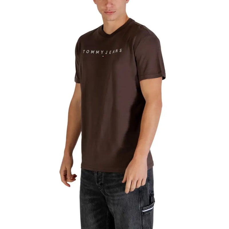 Brown Tommy Hilfiger Jeans men t-shirt featuring a white logo across the chest in a casual cotton fabric