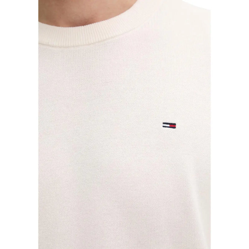 Cream-colored knit crewneck sweater made of organic cotton with embroidered tommy hilfiger logo on left chest