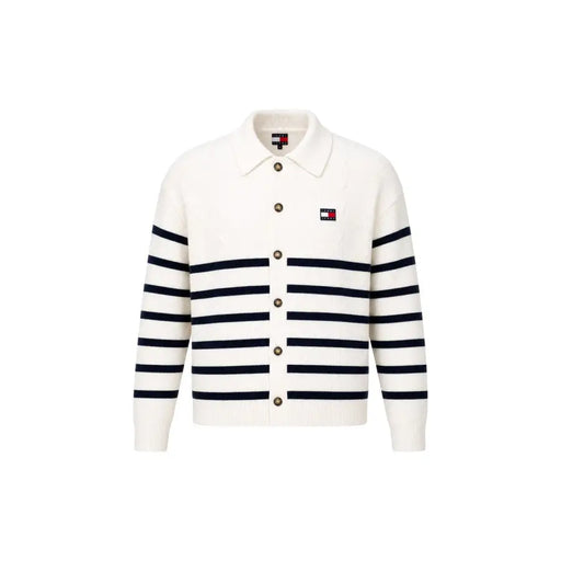 A cream-colored knit cardigan with navy blue stripes and button closure styled with a tommy hilfiger jeans men white organic cotton sweatshirt