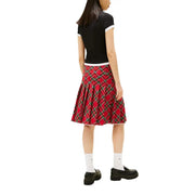 Red plaid pleated skirt with black and green accents paired with tommy hilfiger jeans women black organic cotton t-shirt