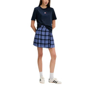 Navy blue and light blue plaid pleated skirt paired with tommy hilfiger jeans women blue organic cotton t-shirt
