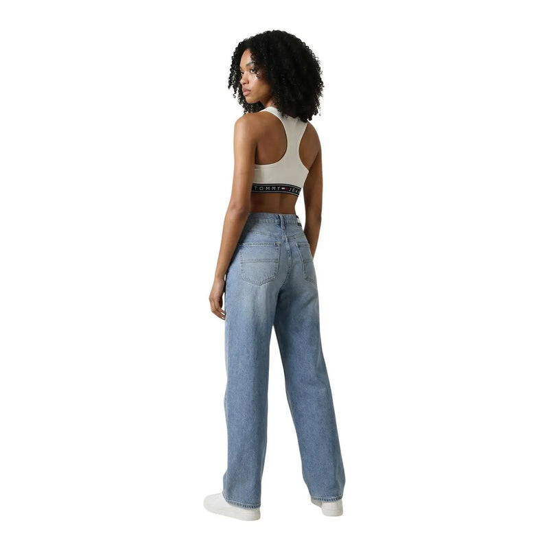 Light-wash denim jeans with wide-leg cut and classic back pockets from tommy hilfiger women sleeveless round neck white top back view