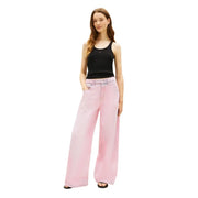 Pink wide-leg denim trousers paired with tommy hilfiger black cotton round neck tank top for women