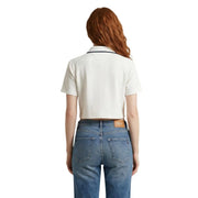 Cream-colored short-sleeved polo shirt with navy trim and branded leather patch at waistband by Tommy Hilfiger Jeans