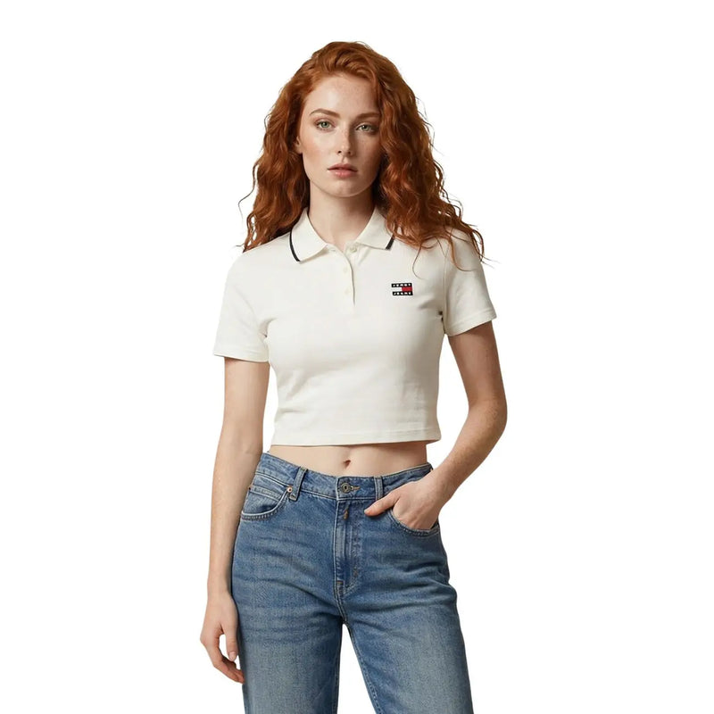 White cropped polo shirt with black trim and small Tommy Hilfiger logo on left chest for women by Tommy Hilfiger Jeans