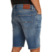 Blue denim shorts with brown leather patch and tommy jeans logo on back pocket made of organic cotton by tommy hilfiger