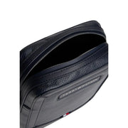 Tommy Hilfiger men blue central mini reporter bag in black textured leather with silver zipper and brand logo plaque
