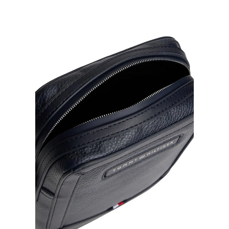 Tommy Hilfiger men blue central mini reporter bag in black textured leather with silver zipper and brand logo plaque