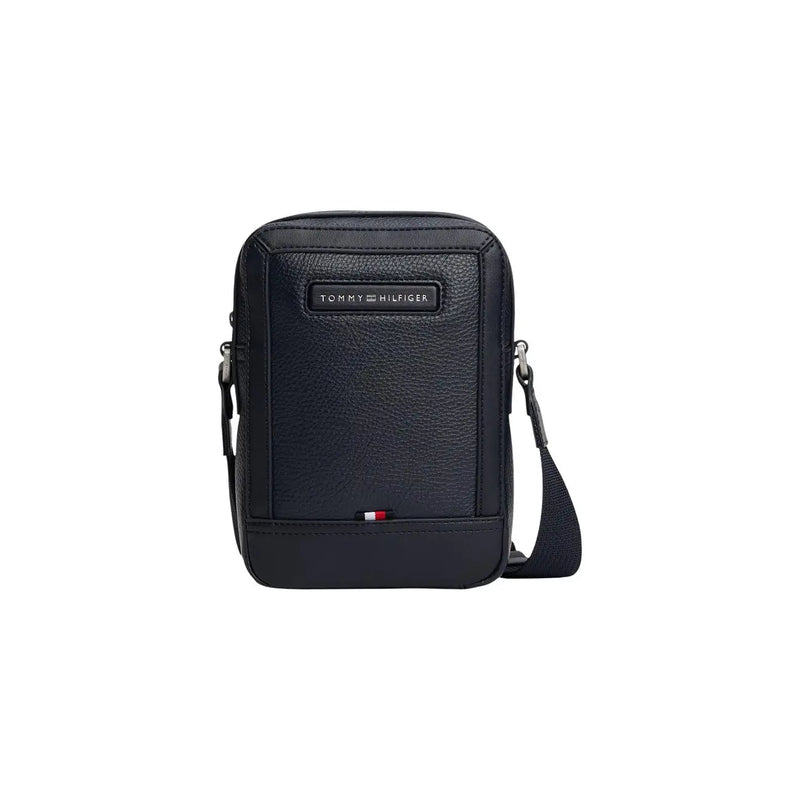 Black textured leather crossbody bag with Tommy Hilfiger logo plaque and flag emblem, 20cm mini reporter style