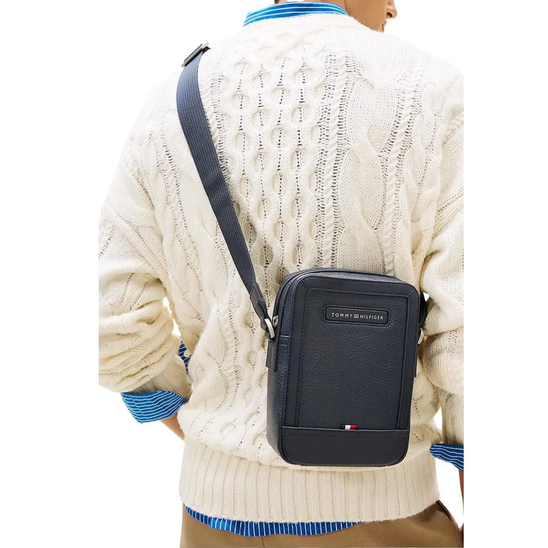 Navy blue leather crossbody bag with Tommy Hilfiger logo plaque and red white blue flag emblem 20cm mini reporter bag