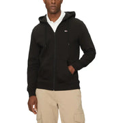 Men’s black zippered hoodie over white polo shirt with beige cargo shorts, Tommy Hilfiger Men Blue Zip Hooded Sweatshirt