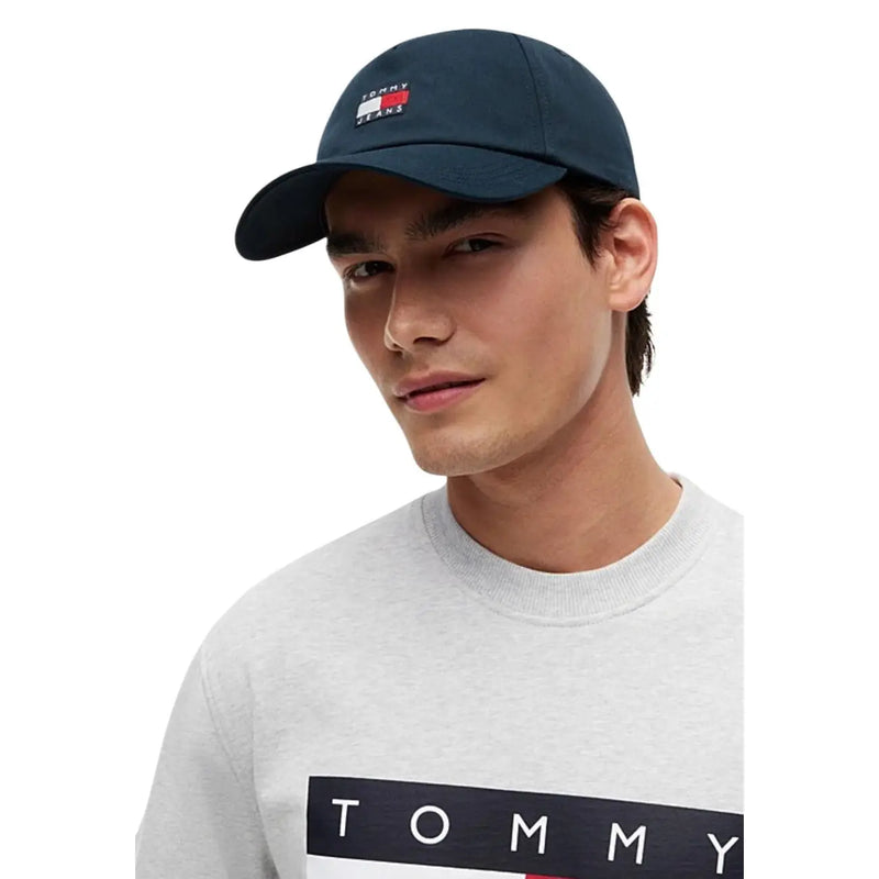 Navy blue tommy hilfiger men cap made of organic cotton with red white and blue logo patch and adjustable buckle