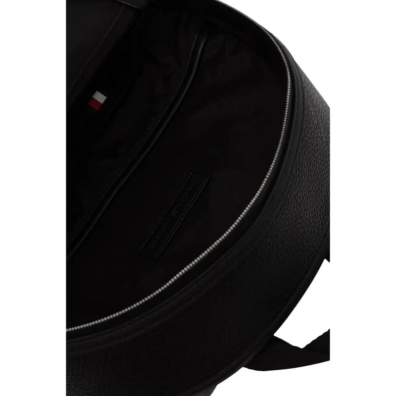 Tommy Hilfiger men central backpack black textured polyurethane with subtle silver zipper and small brand tag inside