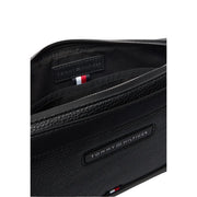 Tommy Hilfiger men central pouch black textured leather crossbody bag with subtle logo plaque and flag trim