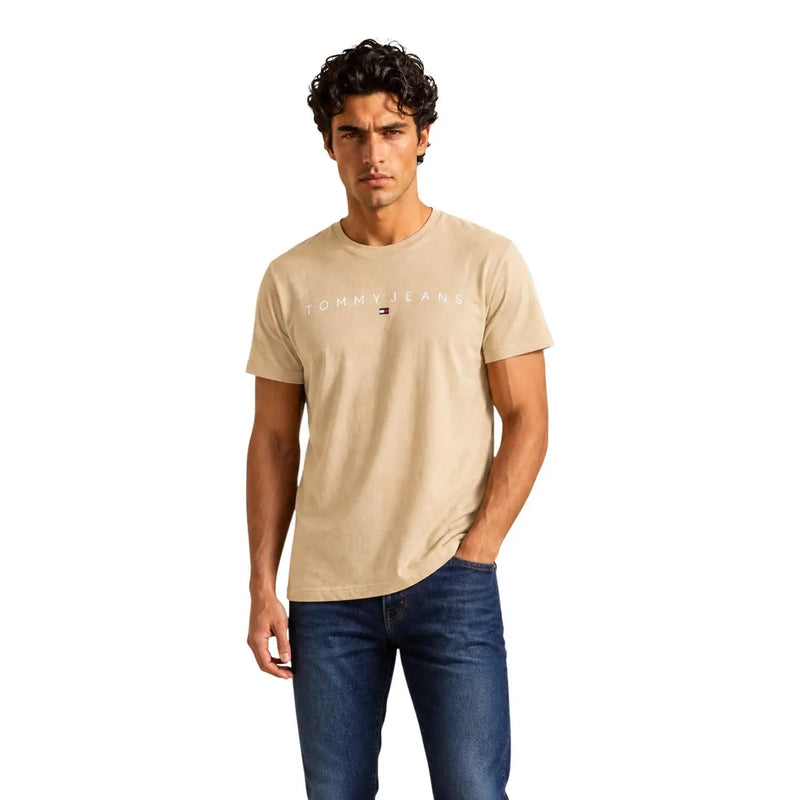 Beige tommy hilfiger men t-shirt with subtle white logo and flag emblem made from organic cotton regular fit