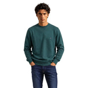 Dunkelgrün Tommy Hilfiger Herren-Sweatshirt aus Baumwollfleece mit Rundhalsausschnitt und kleinem Logo auf der linken Brust.