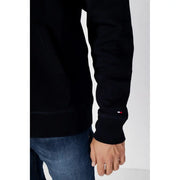 Tommy Hilfiger Sweat à capuche pour homme en coton noir avec un petit logo rouge, blanc et bleu sur le poignet
