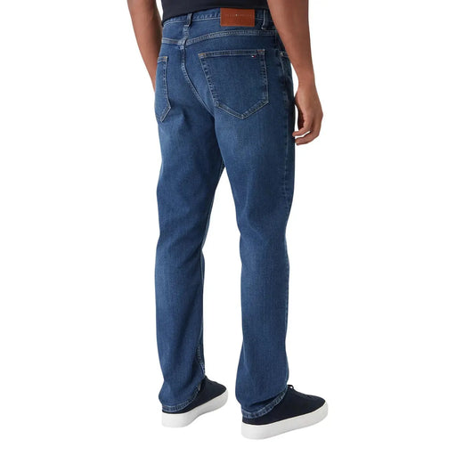 Blue organic cotton slim fit tommy hilfiger men jeans with classic five-pocket design and brown leather brand patch