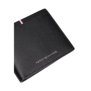 Tommy Hilfiger men wallet black textured leather with silver logo and red white blue striped tab visible on front side