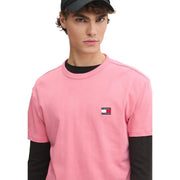 Tommy Hilfiger Herren-T-Shirt aus rosa Bio-Baumwolle, normale Passform, schwarze Langarmshirts und kleiner Logo-Aufnäher auf der Brust.