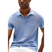 Hellblau Tommy Hilfiger Herren-Poloshirt mit dezenter Webstruktur und gesticktem, ikonischem Flaggenlogo auf der linken Brustseite