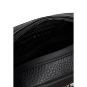 Black textured leather tommy hilfiger crossbody bag with subtle embossed logo on interior lining polyurethane material
