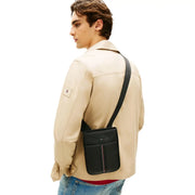 Black leather Tommy Hilfiger men shoulder bag with vertical stripe detail and zip pocket 21x25x5 cm