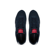 Dark navy Tommy Hilfiger men sneakers in polyester with red branding accents and white rubber soles