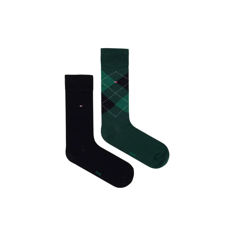 A pair of tommy hilfiger men socks in green cotton blend with one solid black and one green argyle design