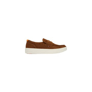 Brown suede slip-on loafer with white rubber sole and orange heel tab from tommy hilfiger men suede moccassin camel shoes