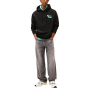 Tommy Hilfiger Sweat-shirt à capuche noir en coton biologique pour homme, doublure intérieure turquoise et logo assorti sur la poitrine.