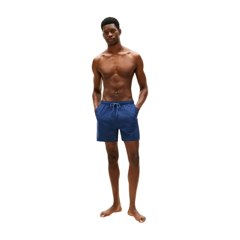 Tommy Hilfiger men swimwear navy blue swim trunks with white drawstring and side pockets for casual beachwear