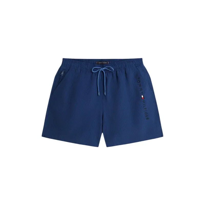 Navy blue tommy hilfiger men swimwear trunks with subtle textured weave and matching drawstring waistband