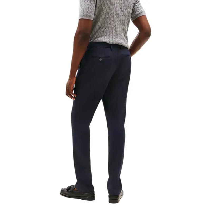 Tommy Hilfiger men trousers in dark navy blue with a sleek slim-fit cut and subtle textured fabric