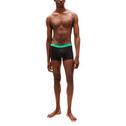 Tommy Hilfiger Schwarze Herren-Boxershorts mit leuchtend grünem Logo-Bund für bequemen Tragekomfort im Alltag