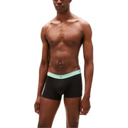 Schwarz Tommy Hilfiger Boxershorts mit helltürkisfarbenem Gummibund und dem Tommy Hilfiger Logo
