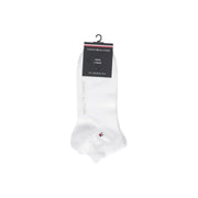White men’s ankle socks by Tommy Hilfiger featuring a subtle red and blue logo on the foot for everyday wear